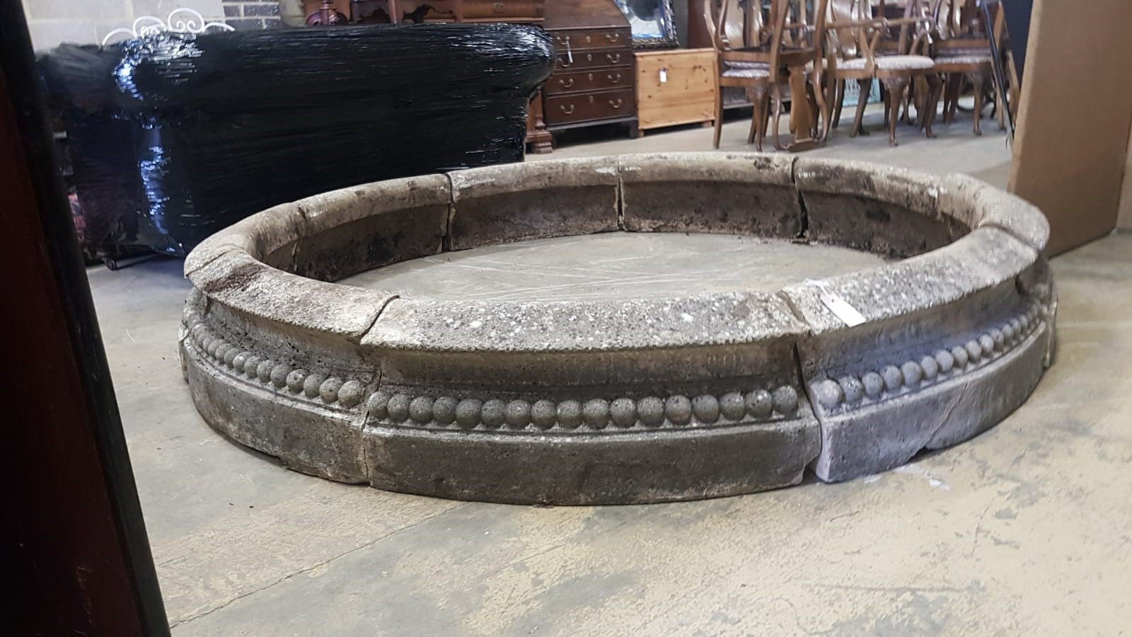 A reconstituted stone circular sectional garden planter, each segment width 68cm, height 28cm